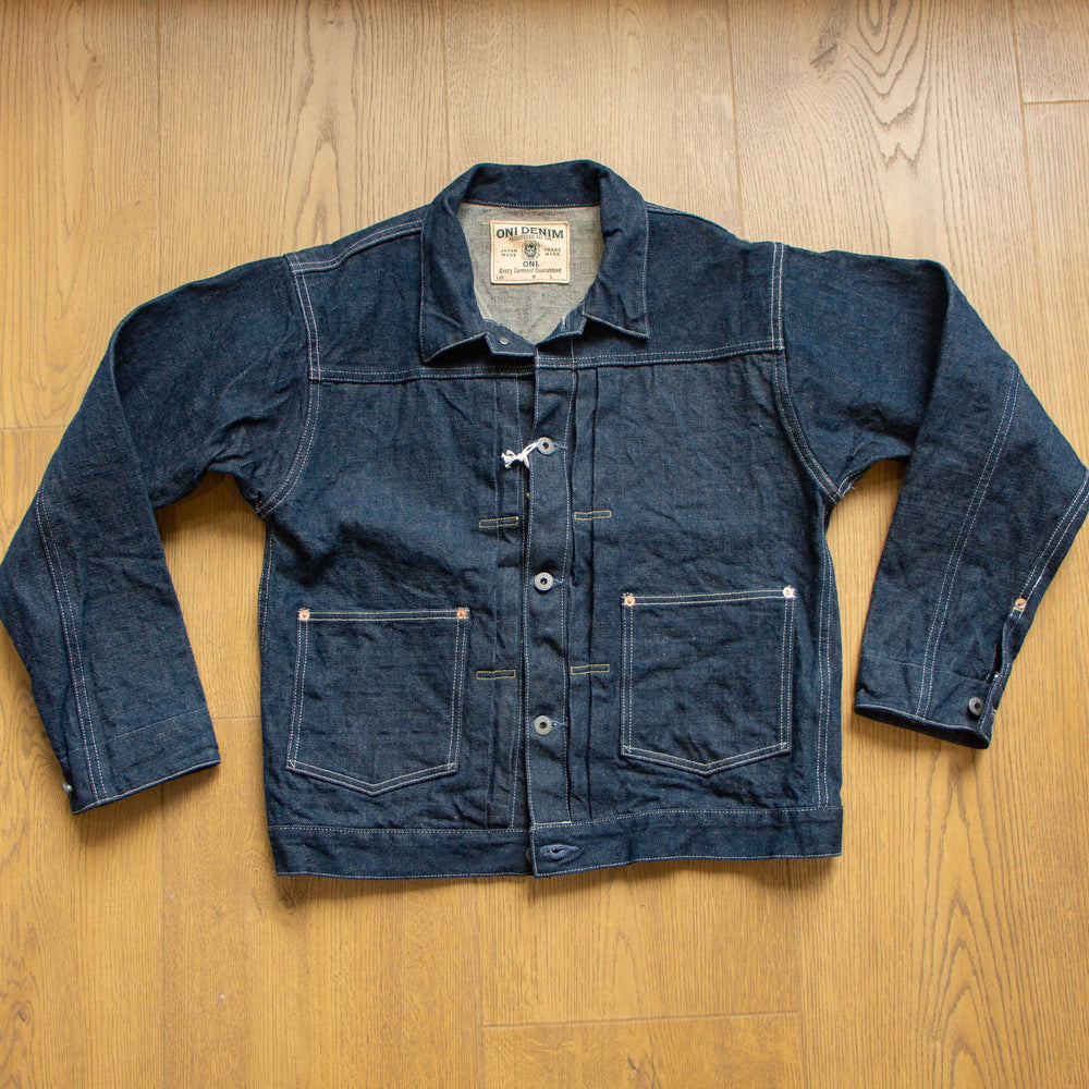 ONI Denim 03517 Ishikawadai 15oz denim jacket folded overview with leather patch and product tag